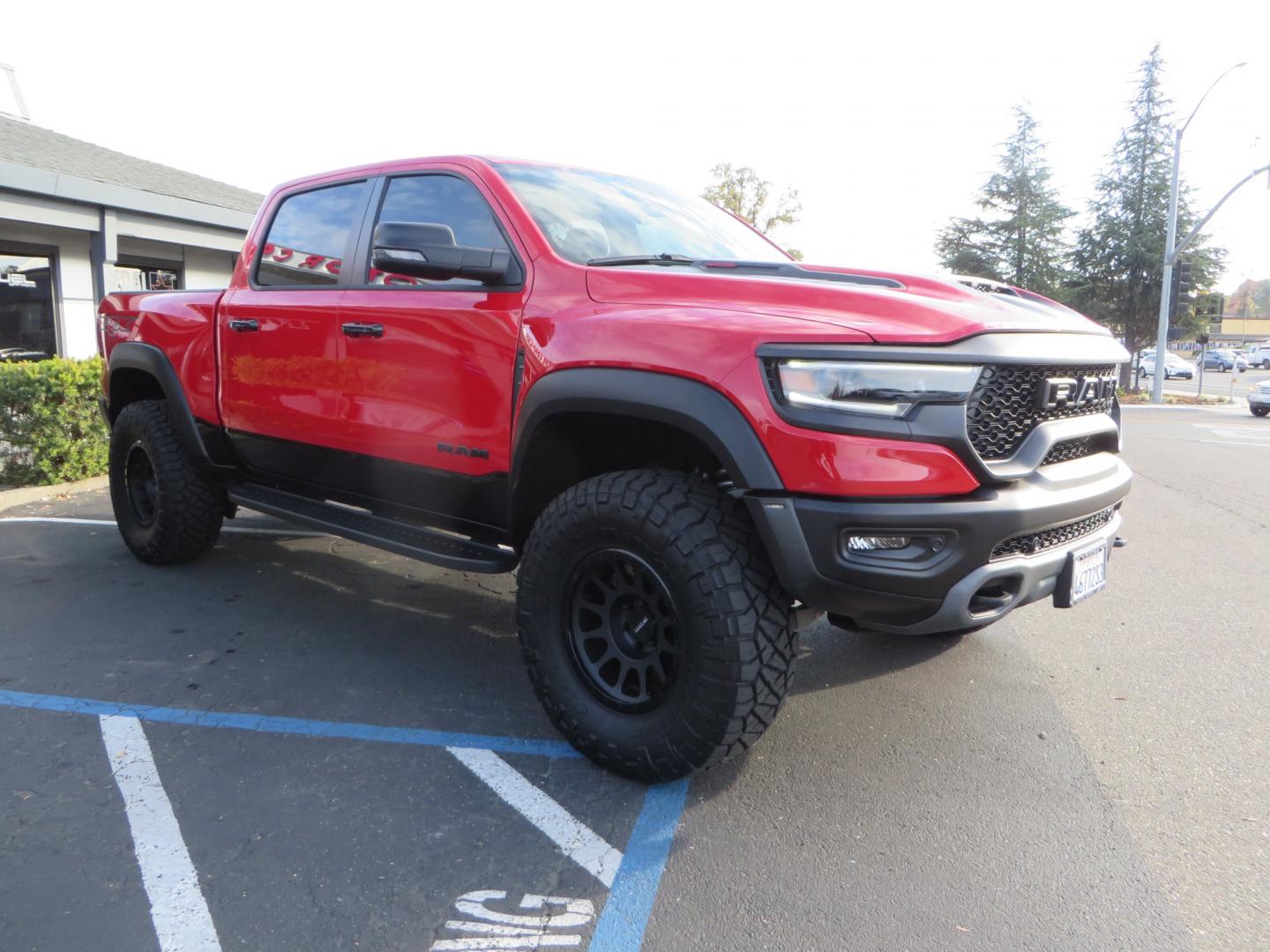 2023 Red /BLACK RAM 1500 Ram 1500 TRX Crew Cab 4x4 (1C6SRFU9XPN) with an 6.2L Supercharged HEMI V8 SRT engine, 8 Speed Auto 8HP95 transmission, located at 2630 Grass Valley Highway, Auburn, CA, 95603, (530) 508-5100, 38.937893, -121.095482 - Must see TRX featuring Eibach front and rear springs, 18" Method NV double black wheels, 37" Nitto Ridge Grappler tires, and window tint. - Photo#3